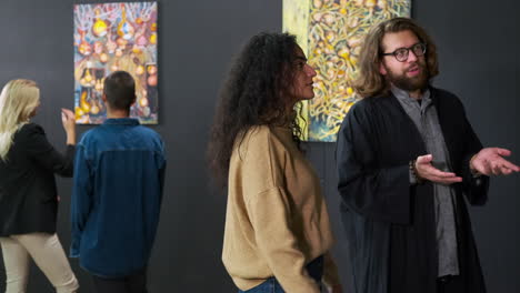 people viewing art in an exhibition