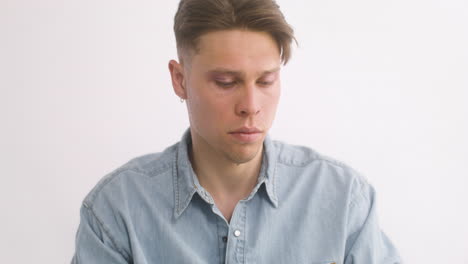 close up of sad blond man crying