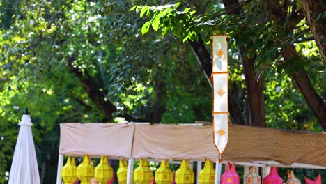 colorful lanterns displayed in a lush park setting