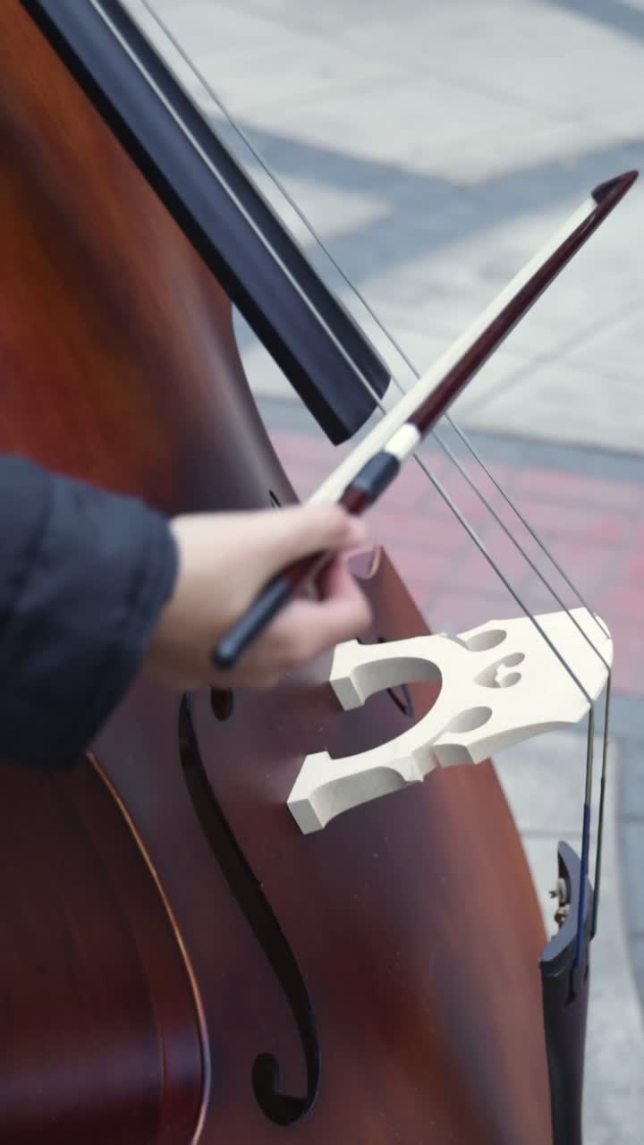 Close-up of Musician Playing Double Bass with Bow