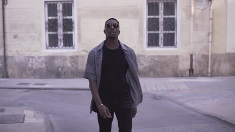man walking on city street