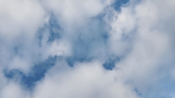 Airplane in Flight Over Clouds
