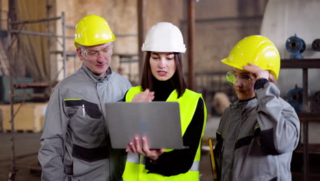 three co-workers at the factory