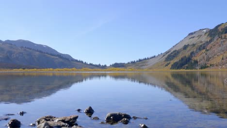 Specular-Reflection-Of-Mountains-And-Sky-In-The-Calm-Waters-Of-Lake