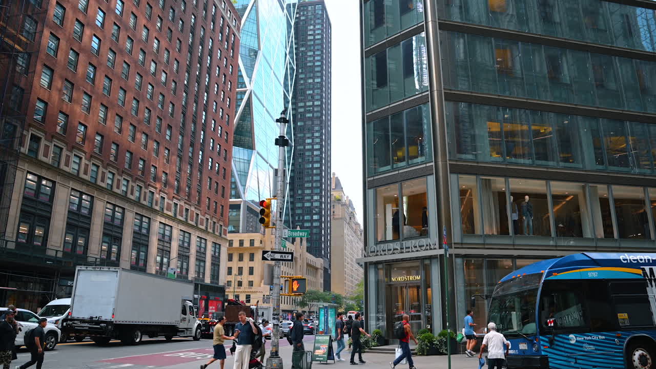 New York, USA, 1 August 2025: Street view of Broadway in Midtown Manhattan. Busy street scene on Broadway with shops, traffic, and people in the heart of New York City