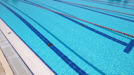 olympic swimming pool background on a bright sunny day