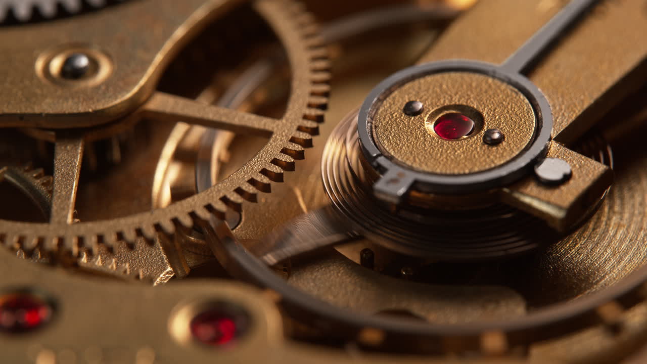 Daylight Slowly Illuminating A Moving Mechanism Of An Old-Fashioned Golden Watch in Macro