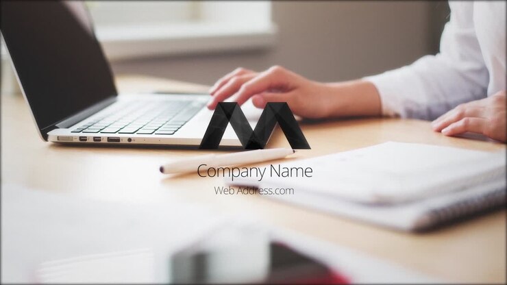 Office workspace with laptop and notebook