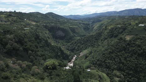 aerial drone travel above magdalena river, green valley in san agustin, colombia mountain vegetation natural destination in latin america