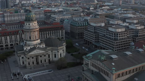 AERIAL:-Empty-Berlin-Gendarmenmarkt-Square-with-view-on-German-Church-and-Konzerthaus-during-Coronavirus-COVID-19-Pandemic