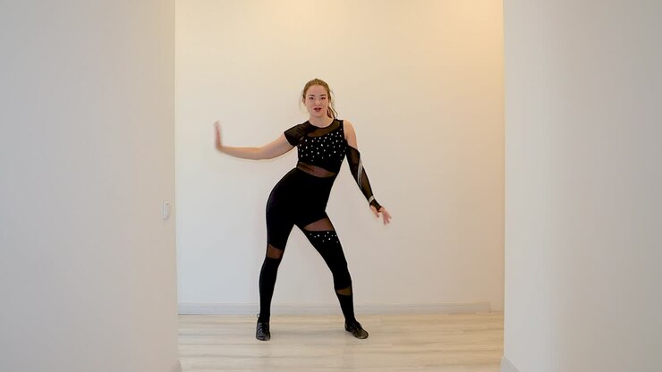 Dance teacher dancing alone in slow motion from home teaching an online dance class