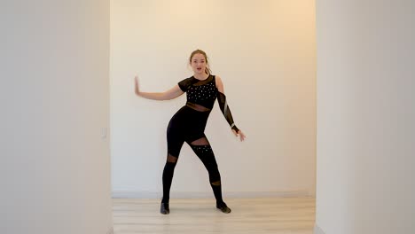 dance teacher dancing alone in slow motion from home teaching an online dance class