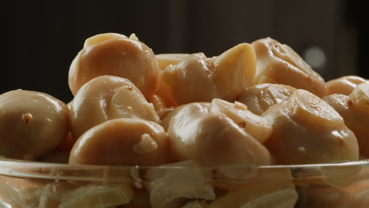 Fermented champignons, Jar with marinated mushrooms on wooden table, traditional salted marinated asian food.
