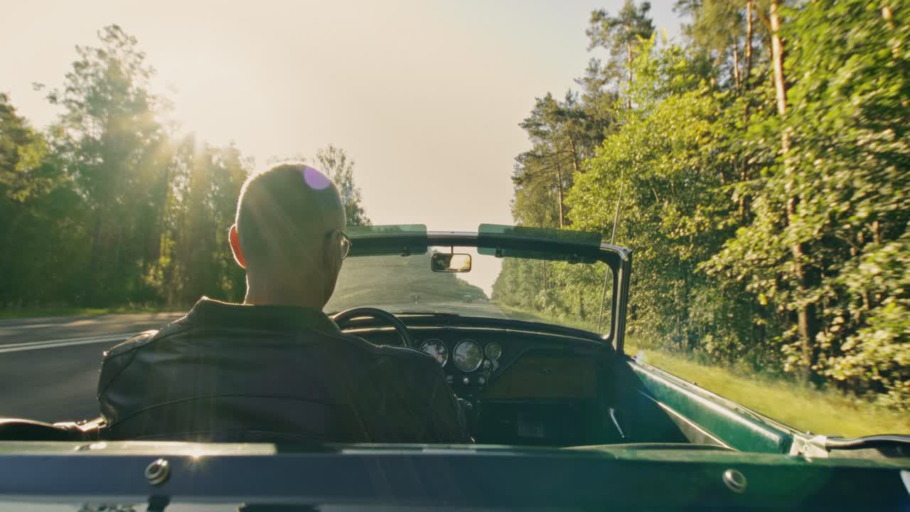 Man Driving a Convertible on a Scenic Road Trip