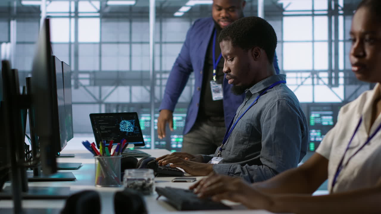 Team of Diverse IT Professionals Working in a Data Center