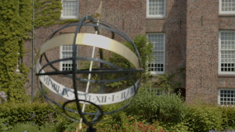 close focus rack from brick wall to armillary sundial