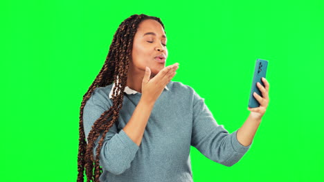 Selfie,-woman-and-blowing-kiss-on-green-screen