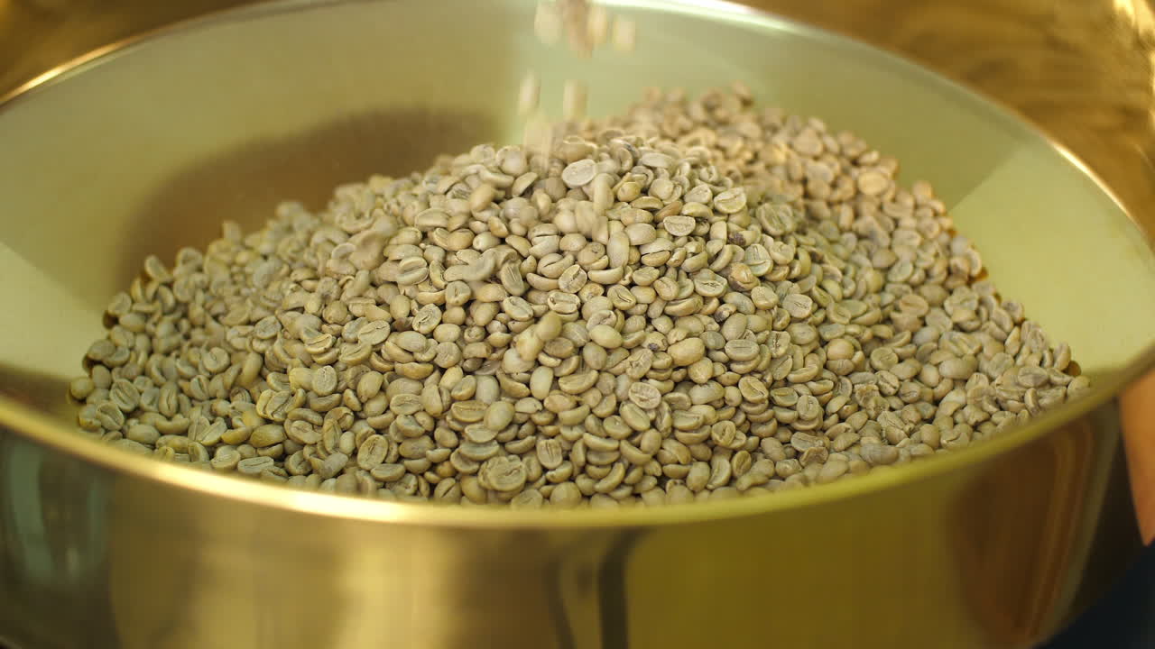 Pouring Raw Coffee Beans Into A Modern Machine