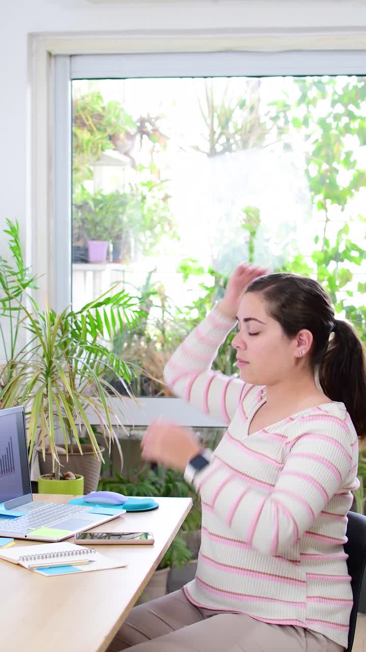 Women performing exercises and stretching in front of a laptop. Working at home, health concept.