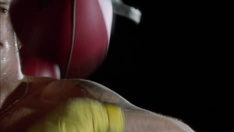 a boxer practices his punches on a speed bag