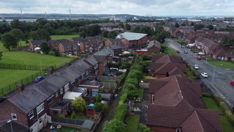 suburban neighbourhood residential northern british housing estate homes aerial view rising pan right