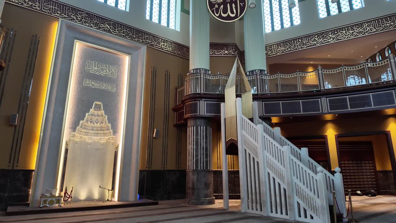 Interior of a Grand Mosque with Ornate Islamic Architecture and Calligraphy