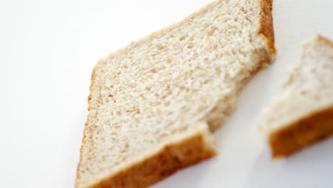 bread slice with broken edge on white background