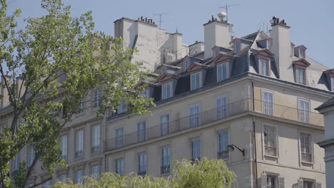 close up of apartment blocks in paris france viewed from river seine in slow motion 1