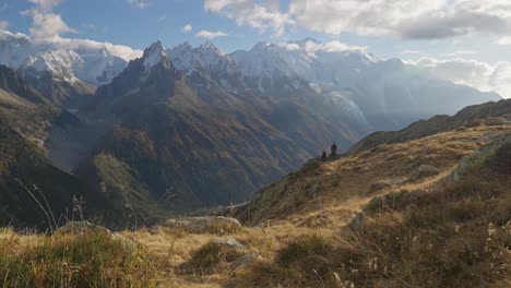 adventurous couple hiking in serene mountains of the france alps