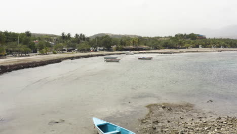 aerial - boats moored on the beach in monte rio, dominican republic, forward