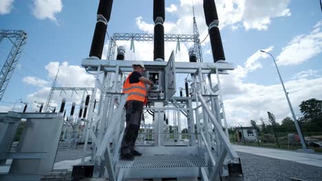 electrical engineers inspect the electrical systems at the equipment control cabinet