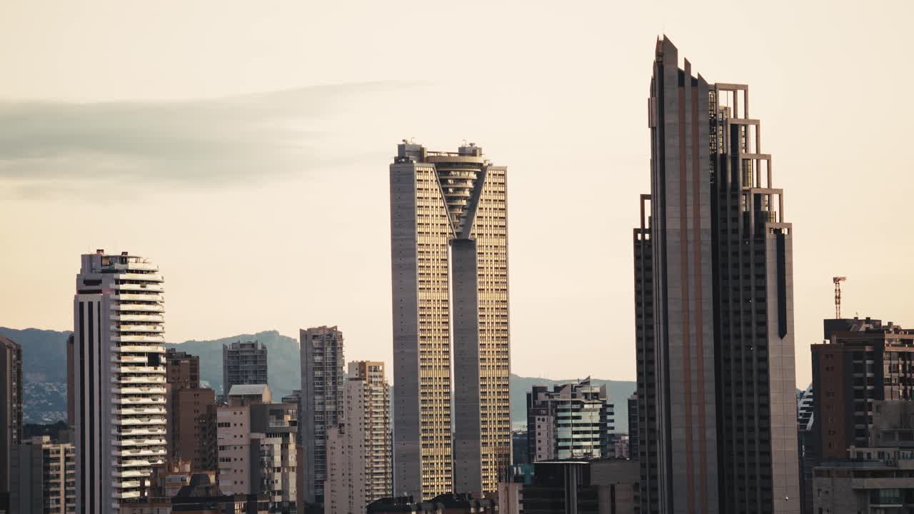 Beautiful skyscrapers of Benidorm city with pastel sky colors