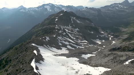 Flying-along-the-snowy-mountain-ridge-in-the-summer