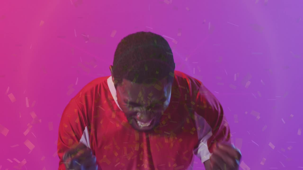 animación de confeti cayendo sobre el futbolista afroamericano celebrando