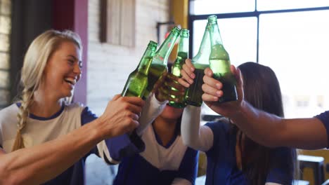 friends at the bar in a pub having fun