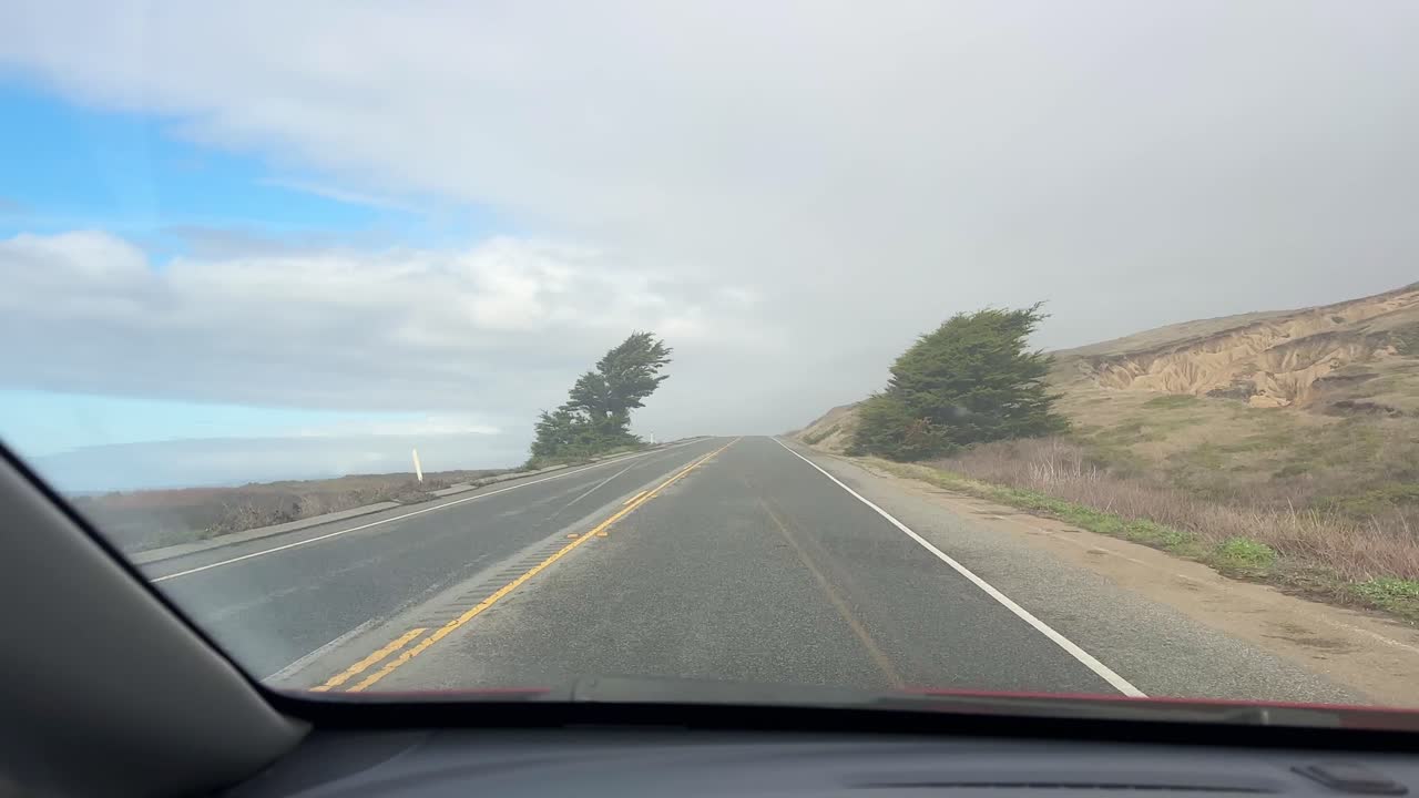 POV shot from a moving vehicle on Pacific Coast Highway near Half Moon Bay in Northern California. 4K