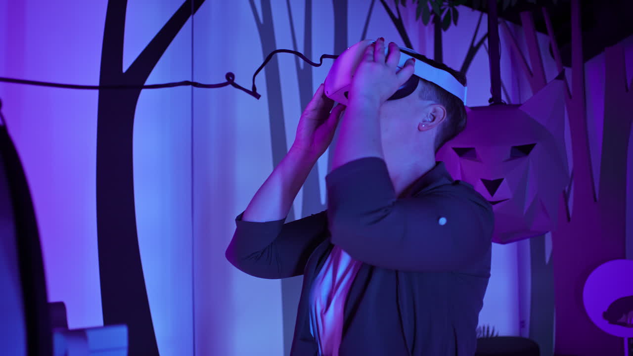Young woman using VR glasses in a natural history museum playroom, close up