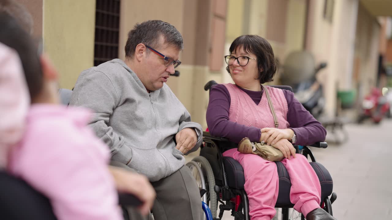 People with Disabilities Enjoying Outdoor Conversation