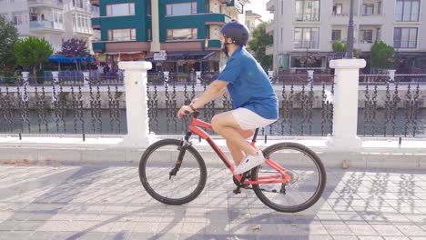 young man cycling in the city.