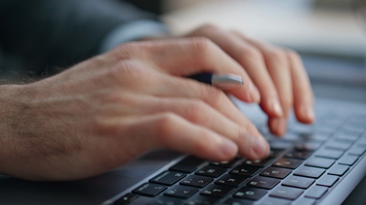 Businessman hands texting laptop holding pen at cabinet closeup. Man typing