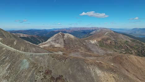Aerial pullback from top of offroad switchbacks at Peak 10 trail Breckenridge Colorado