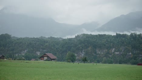 mountain fog farm rain cloudy moody switzerland village