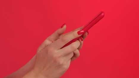woman using a red smartphone