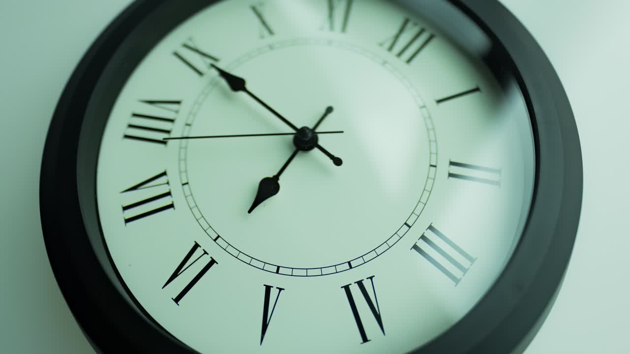 Close-up time lapse of a  old-fashioned antiquated wall clock with roman numerals