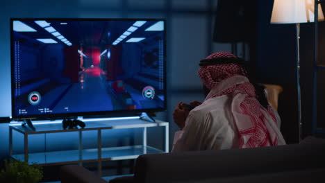 man playing videogames on tv