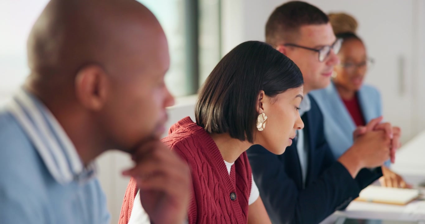 Diverse Group of Professionals Attending a Business Meeting