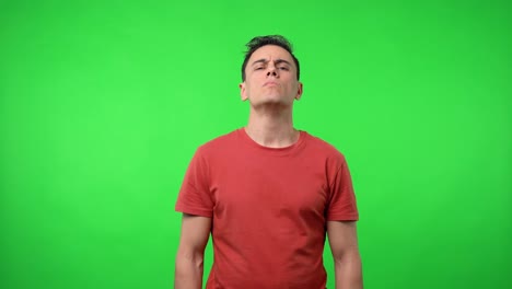 man looking seriously at camera.con red shirt.