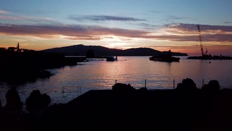 sliding shot of purple sunset in madalena port, amazing shadows of the coast