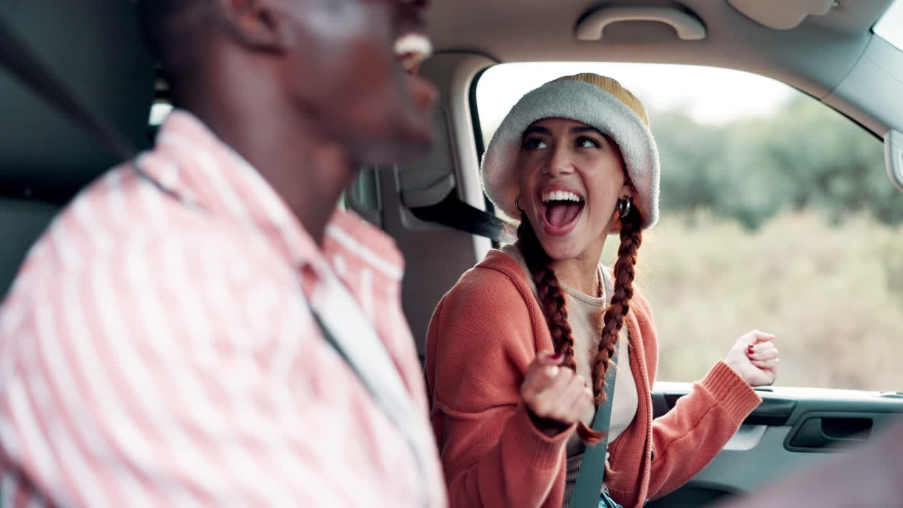 Couple enjoying a car ride and singing together