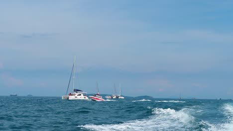 catamarans, yachts and speedboats in andaman sea